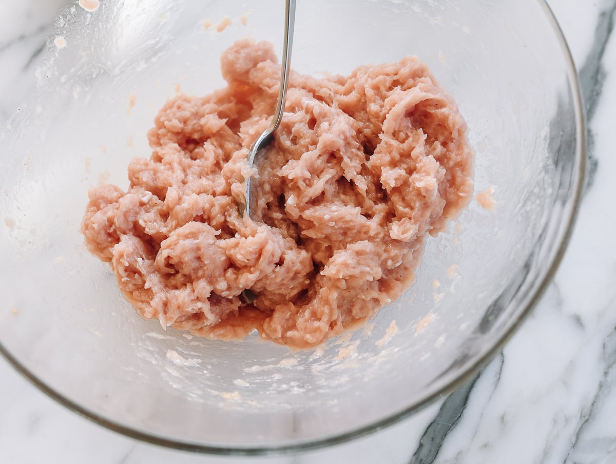 marinated ground chicken in glass bowl