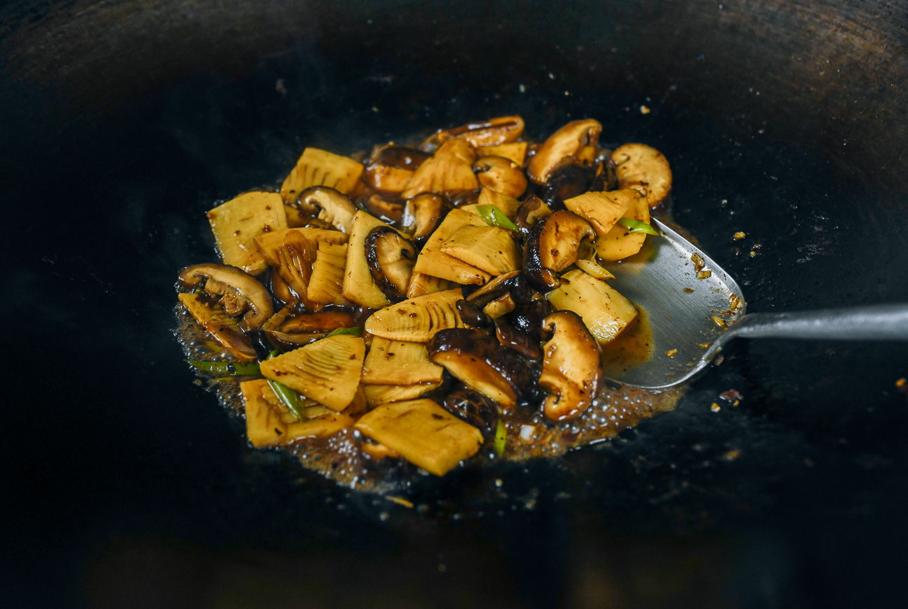 chinese braised bamboo and mushrooms in wok