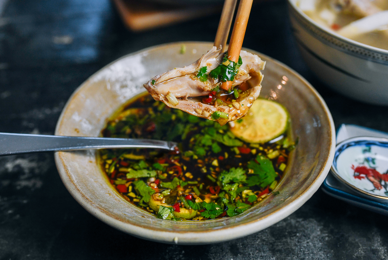 dipping chicken into dipping sauce