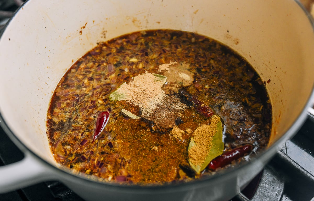 seasonings in pot with braising liquid