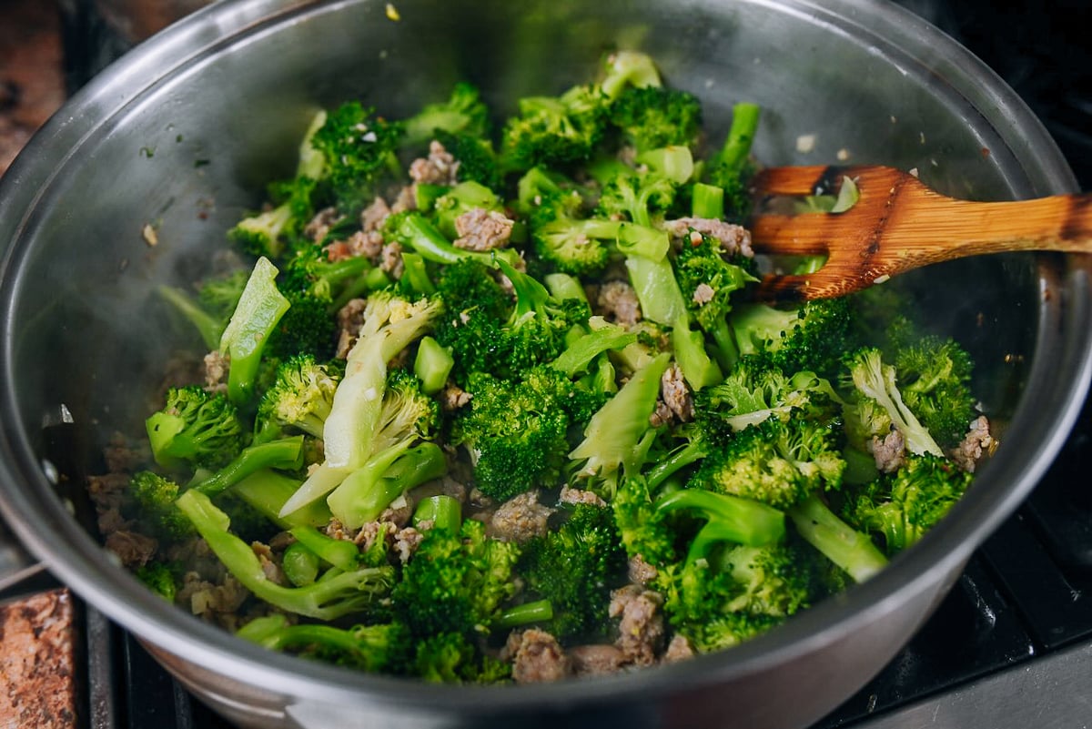 cooked broccoli with crumbled sausage