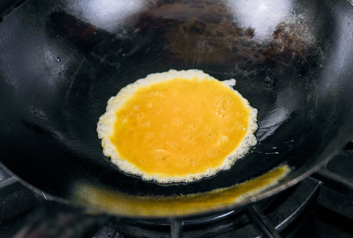 scrambling eggs in wok
