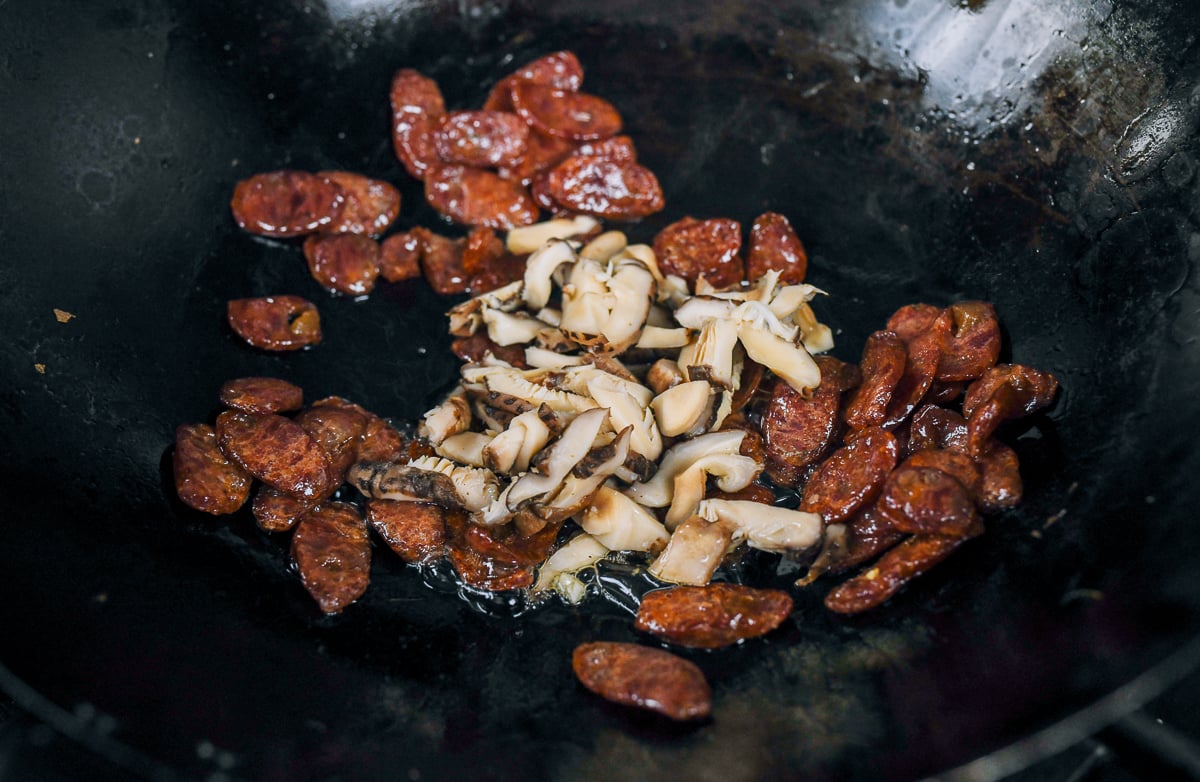 cooking lap cheong and mushrooms