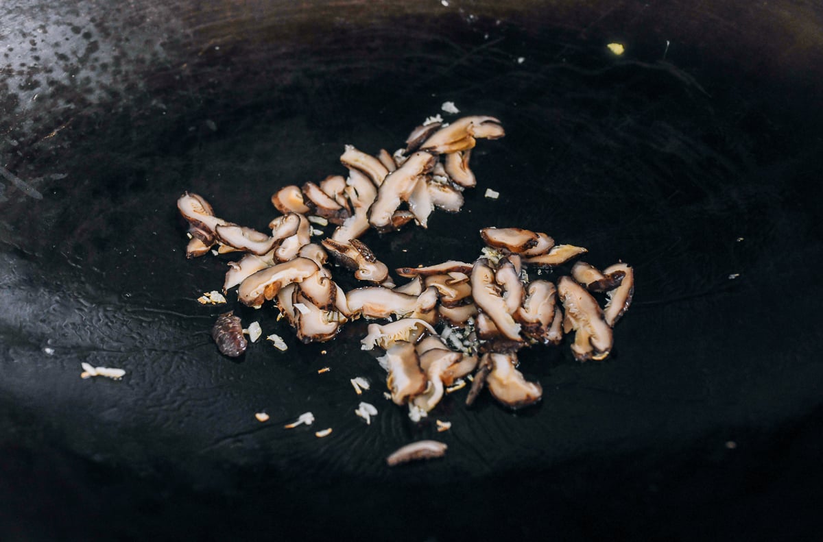 mushrooms and garlic in wok