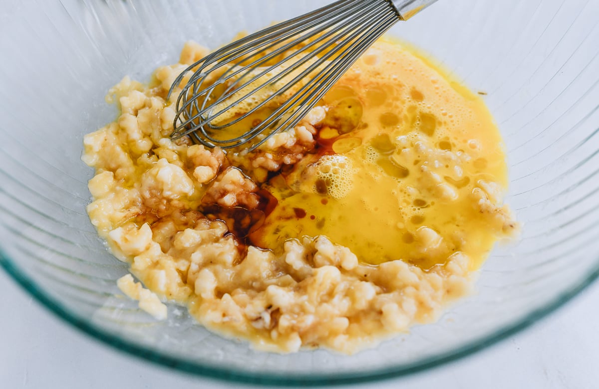 adding beaten egg and flavorings to banana