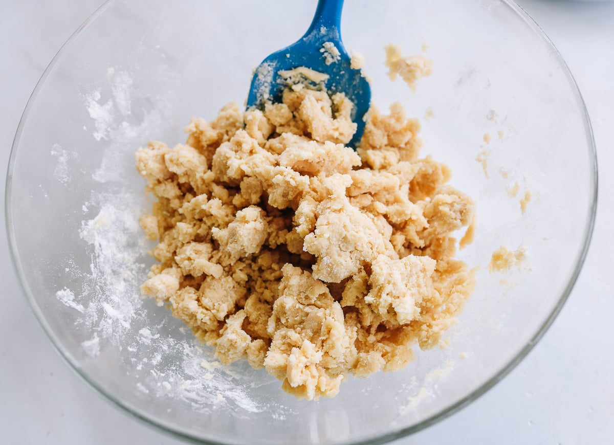 crumbly shortbread dough in glass bowl