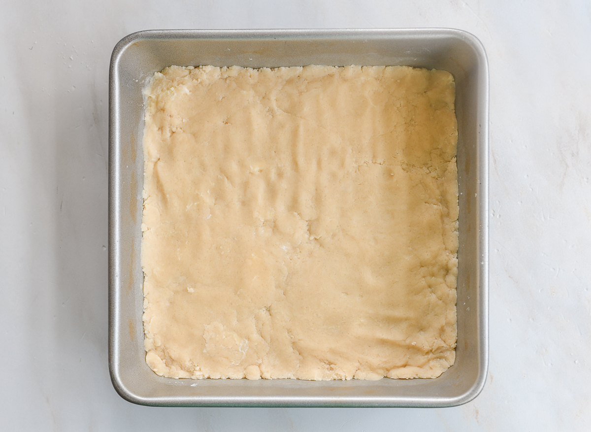 dough pressed into 9x9 inch square pan for crust
