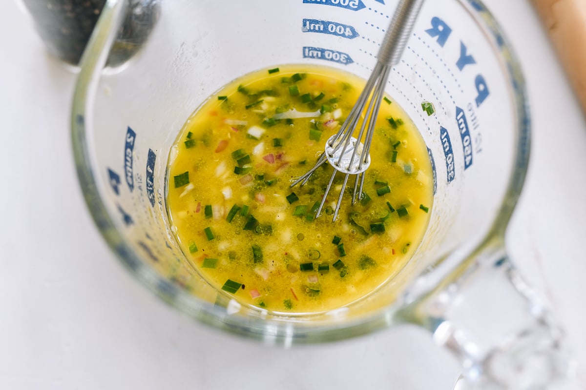 shallot vinaigrette in measuring cup