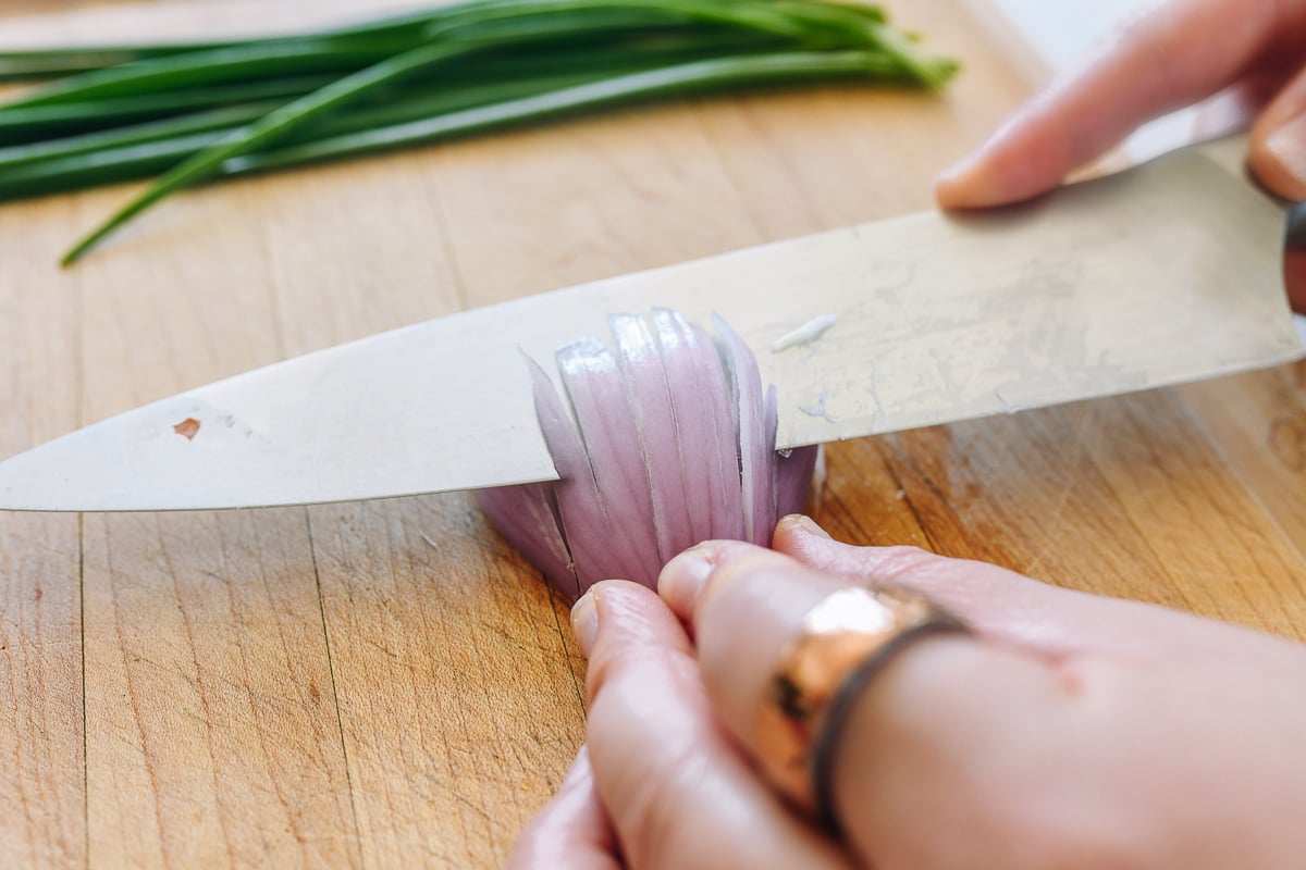 making perpendicular cut into shallot