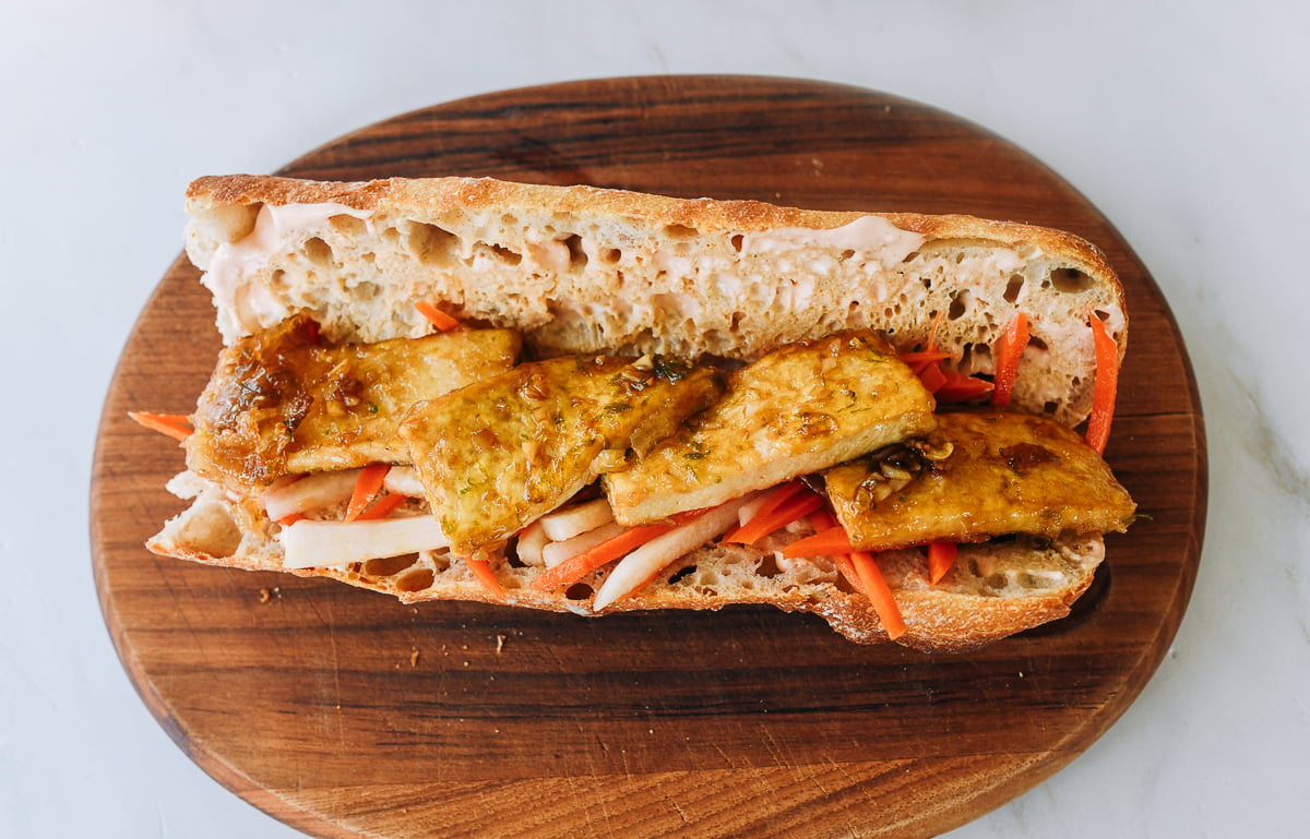 tofu and carrot daikon salad on baguette