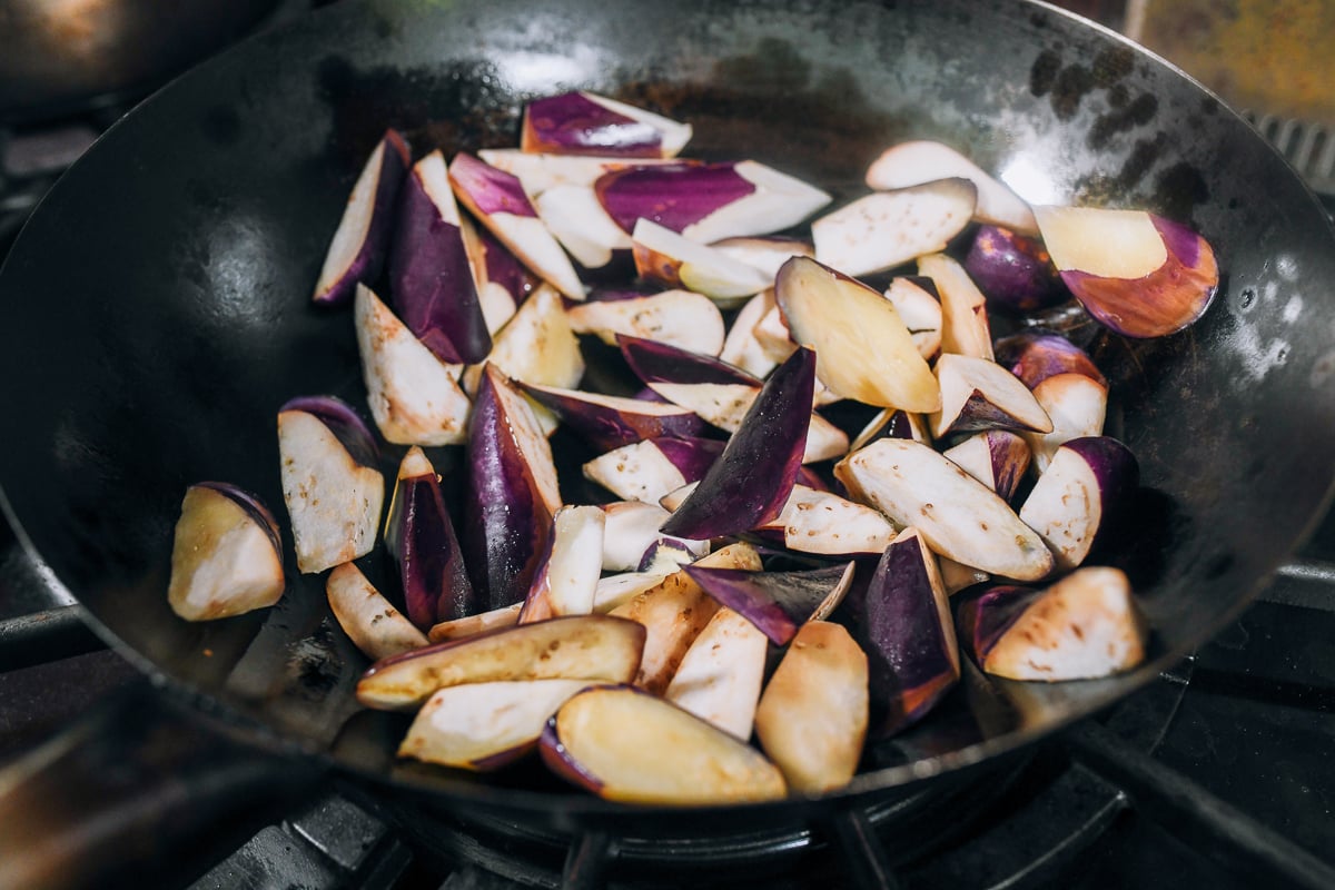 searing eggplant in wok
