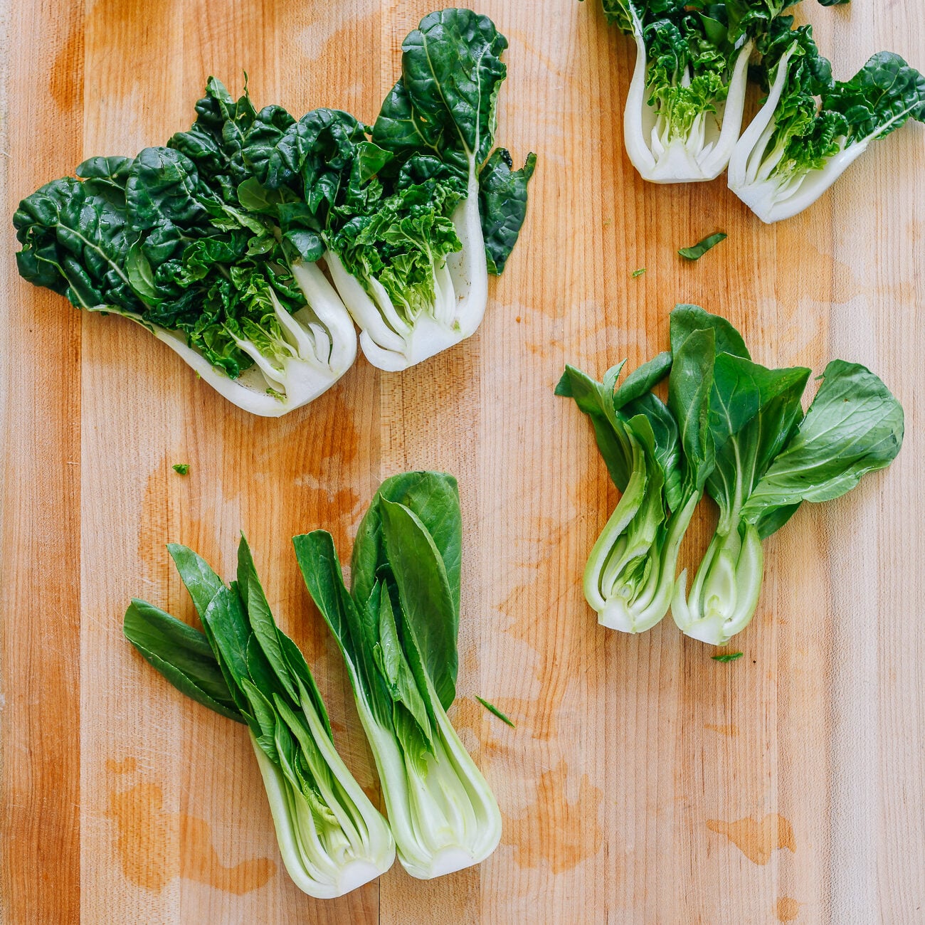 different types of bok choy on cutting board